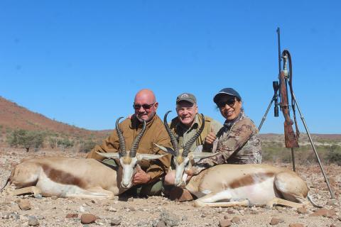 Hunters and springbok