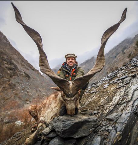 hunter with ibex