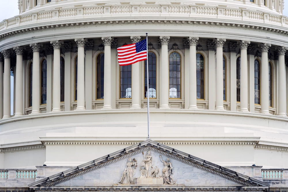 Washington DC Capitol detail with american flag.